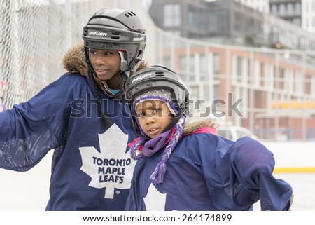 TORONTO,CANADA-JANUARY 3,2015: Community children enjoyed a beautiful learning day during the official opening of the Regent Park ice rink. A partnership between the city and private investors