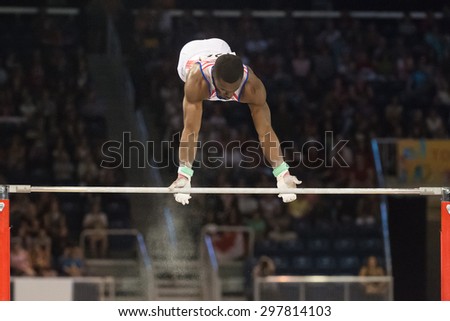 TORONTO,CANADA-JULY 15,2015: Manrique Larduet Cuban gymnast in competing in Horizontal Bar during the gymnastic artistic of the Toronto Pan American Games 2015 CN 01953074