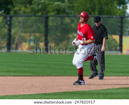 TORONTO,CANADA-JULY 12,2015: Toronto Pan American Games 2015, Baseball : Pinch hitter Brock Kjeldgaard substitutes Jordan Lennerton and bats a home run in the bottom of the 8th inning
