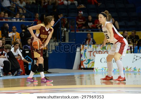 TORONTO,CANADA-JULY 16,2015: Toronto 2015 Pan Am or Pan American Games, women basketball: Michelle Plouffe (15) defends the team Canada territory against the attack of the Venezuelan team.CN 01953074