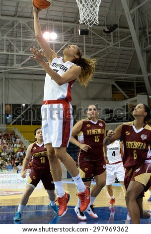 TORONTO,CANADA-JULY 16,2015: Toronto 2015 Pan Am or Pan American Games, women basketball: Nayo Raincock-Ekwune (7) from team Canada high jump and scores a two point shot.CN 01953074