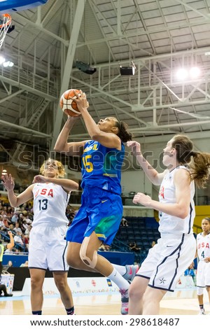 TORONTO,CANADA-JULY 16, 2015: Toronto 2015 Pan American Games, women basketball: Kelly Santos (15 blue) jumps toward the US hoop while Breanna Steward and Taya Reimer from the USA defend.CN 01953074