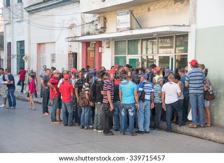 SANTA CLARA,CUBA-SEPTEMBER 20,2015:Store for rewarding best workers or benefits shop. Line outside a store which sells at better prices to selected best workers in their government run companies
