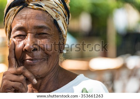 HAVANA,CUBA- AUGUST 9,2015: Cuban Afro Caribbean woman in Old Havana. People are friendly and an attraction for photographers.Old Havana is a Unesco World Heritage Site and a major tourist landmark