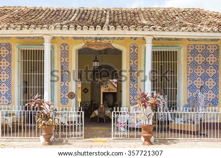 TRINIDAD,CUBA-JULY 5,2015: Facade of old colonial house turned into a restaurant. Private business are getting stronger after the economic changes of the Raul Castro government.