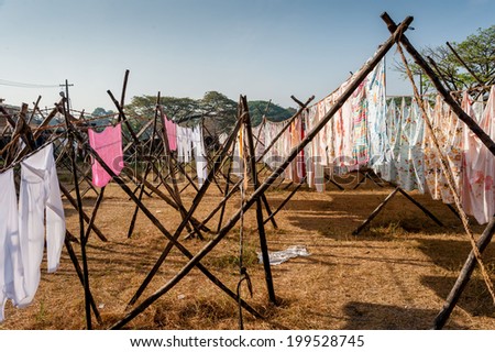 Hand washed clothes drying in sunlight at Dhoby Khana in Cochin, India.