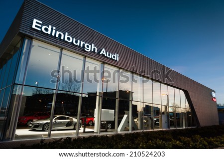 EDINBURGH, SCOTLAND - DECEMBER 09, 2012:Audi logo sign on showroom premises photographed before dawn on 09 December 2012 in Edinburgh.