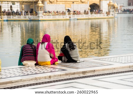 Sikh pilgrims at the Golden Temple in Amritsar, Punjab, India. The Golden Temple is the holiest pilgrimage site for the Sikhs.