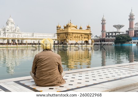 Sikh pilgrim at the Golden Temple in Amritsar, Punjab, India. The Golden Temple is the holiest pilgrimage site for the Sikhs.