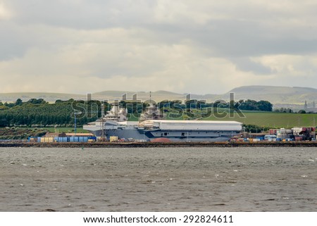 ROSYTH, SCOTLAND - MAY 29, 2015: HMS Queen Elizabeth, the first of two aircraft carriers being built by British defence firm BAE Systems, at the Rosyth Dockyard in Fife, Scotland