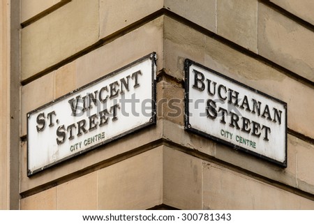 Street signs at the corner of St Vincent Street and Buchanan Street in Glasgow.