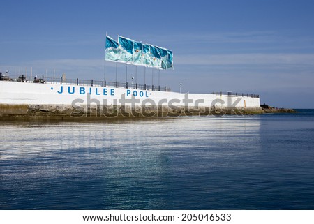 Flags on the Jubilee Pool, Penzance, Cornwall, UK. The pool is one of the oldest surviving Art Deco swimming baths in the UK and was opened in 1935, the year of King George V\'s Silver Jubilee.