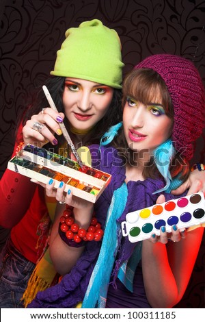 Best friends. Two young artist\'s with with drawing tools