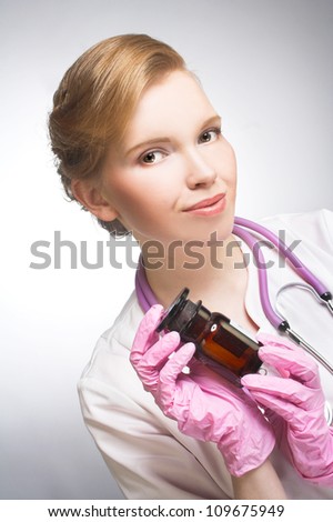 The doctor. Portrait of young woman in doctor\'s smock.