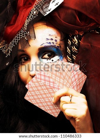 Queen of spade. Young lady in exotic hat with play-card's