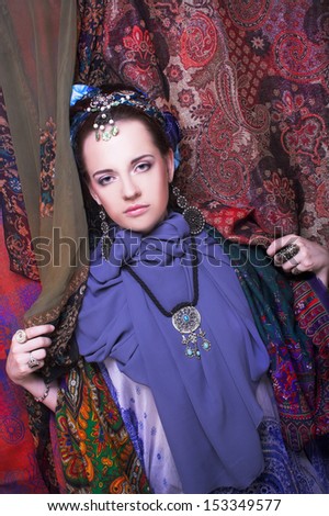 Gypsy girl. Portrait of young woman in ethnic cosrume.