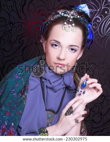 Gypsy girl. Portrait of young woman in ethnic costume.