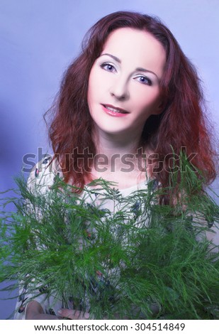 Romantic portrait of young charming woman with ginger hair.