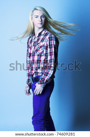 Portrait of young man with long hair.