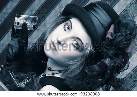 Detective lady. Young woman in creative retro style with pincers