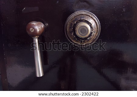 Close-up of an antique bank safe door.