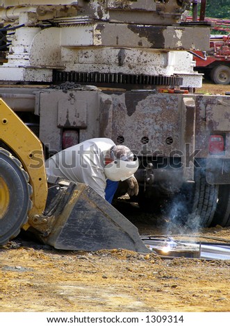 Welder Working at Oil Rig Site