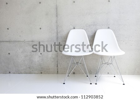 White Chair And Concrete Wall