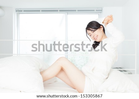 beautiful young woman on the bed