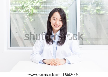 young doctor woman in ??consultation room