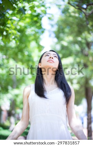 beautiful young woman taking a deep breath