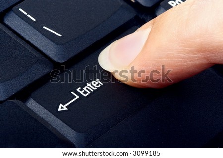 Female finger on the enter key