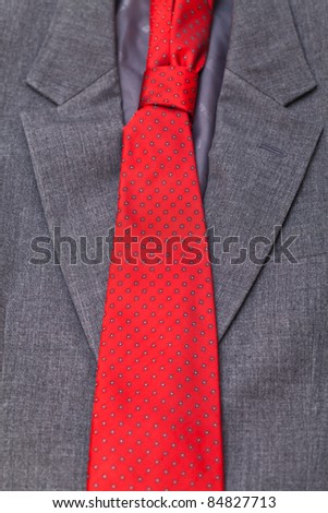 necktie tied on black pinstriped shirt