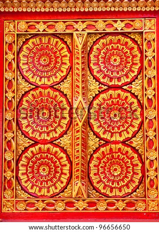 Pattern in traditional Thai style art painting on window of the church in thai temple