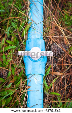 blue pvc pipe connection with valve.