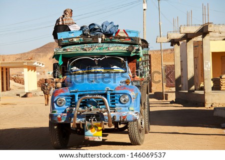 WADI HALFA, SUDAN - JANUARY 7: Sudanese peasant rides old truck on January 7, 2010 in border town of Wadi Halfa, Sudan. Sudan remains one of the least developed countries in the world.