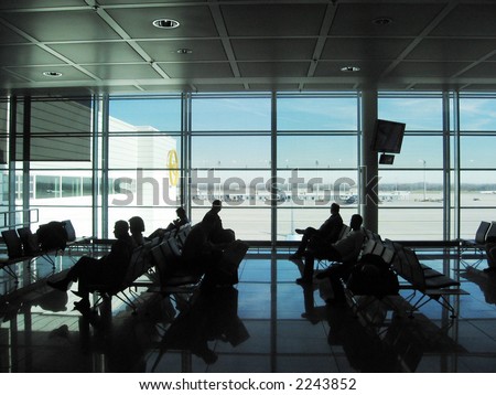 People silhouette in the waiting lounge in airport