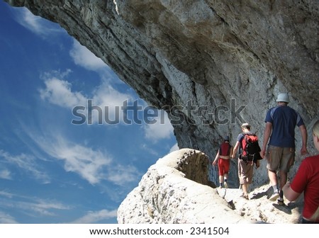 Four person on trek in rock