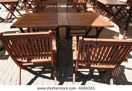Woods chairs in street restaurant