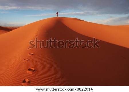 Men observed sand desert