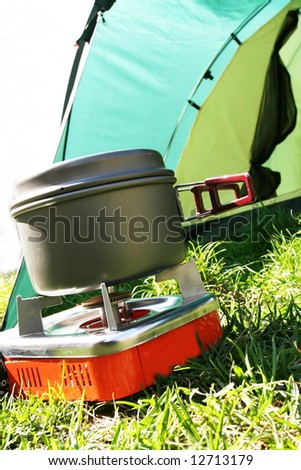 Tent and gas burner  in forest camping