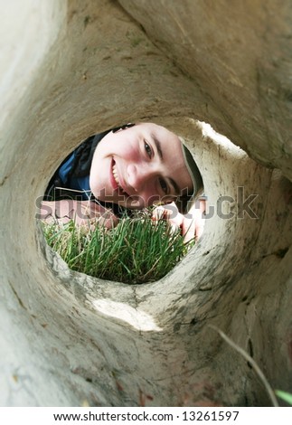 Boys face in stone hole