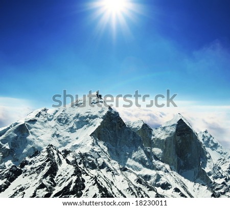 Sun and snow in mountains