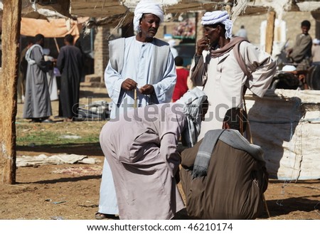 DARAW, EGYPT - DECEMBER 29: Arab people are bargaining at weekly camel and livestock market on December 29, 2009 at Daraw town near the Aswan.