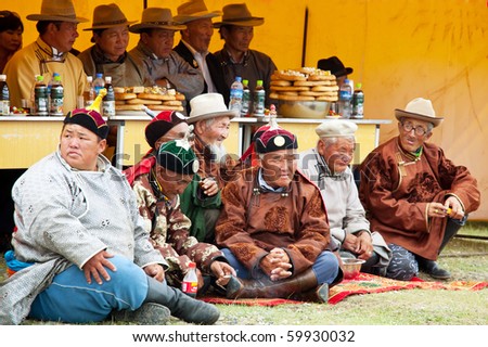 MOON SUM, MONGOLIA - JULY 25: arbiters of traditional Mongolian fighting festival on July 25, 2010 in Moon Sum, Mongolia. Annual holiday in honor of town birthday.