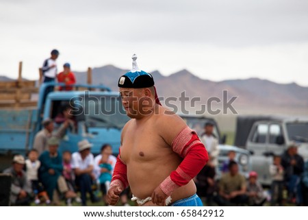 MOON SUM, MONGOLIA - JULY 25: traditional mongolian fighting festival on July 25, 2010 in Moon Sum, Mongolia. Annual holiday in honor of town birthday.