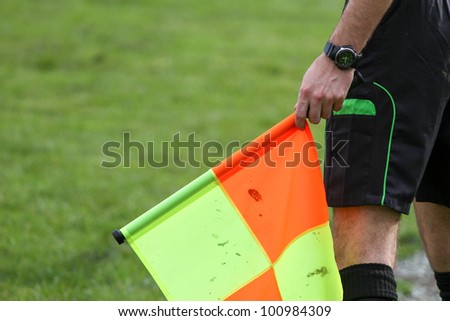 soccer referee hold the flag