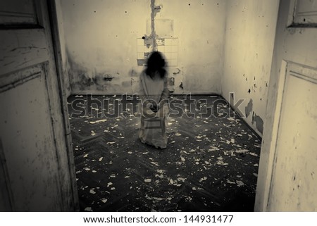 Horror scene of a scary woman in the dark room