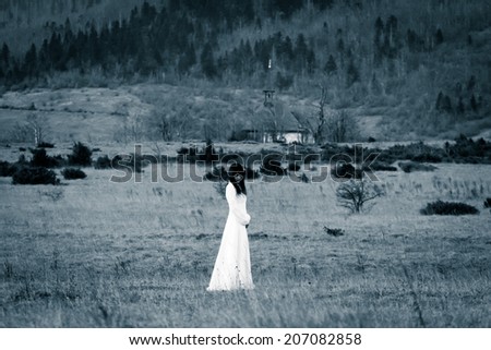 Lady in white dress - horror scene, vintage filter