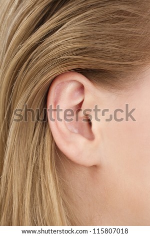 blonde woman ear closeup