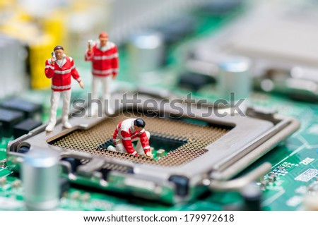 Group of paramedics recovering damaged CPU. Technology concept